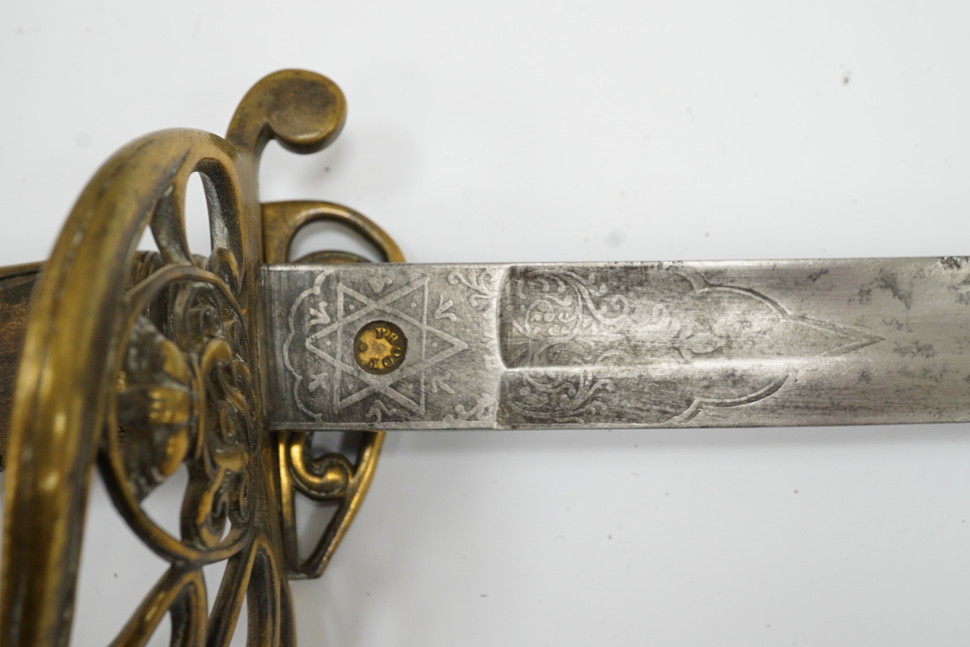 A Victorian 1845 pattern infantry officer’s sword, with regulation blade and brass hilt with folding side guard. Condition - fair, well worn over all.